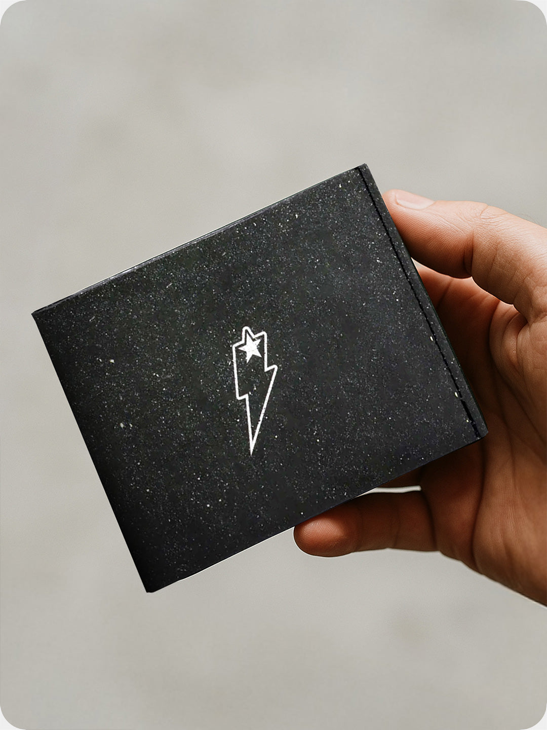 Supervek Tyvek wallet with "Space Out" design, minimalist black vegan billfold featuring starry texture, ultra-slim and water-resistant