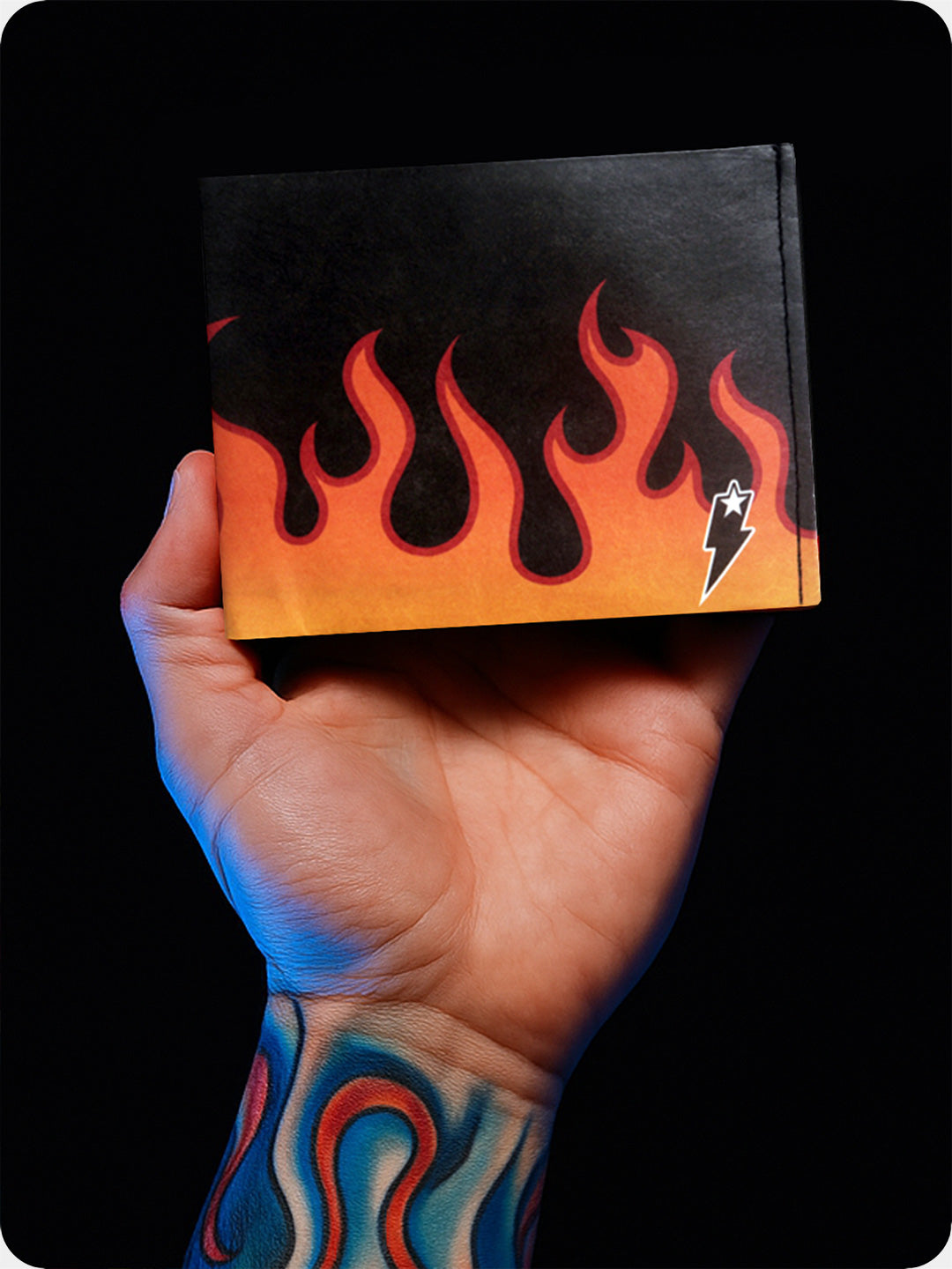 Supervek Tyvek wallet with "Lit" design held in tattooed hand, showcasing slim black billfold with bold graphics