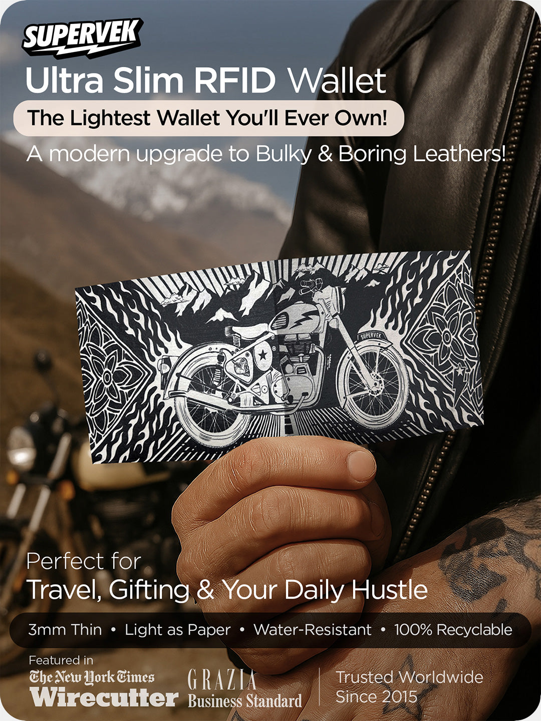 Supervek "Royal Blaze" Tyvek wallet with design, black RFID-blocking vegan billfold shown in hand with mountains behind