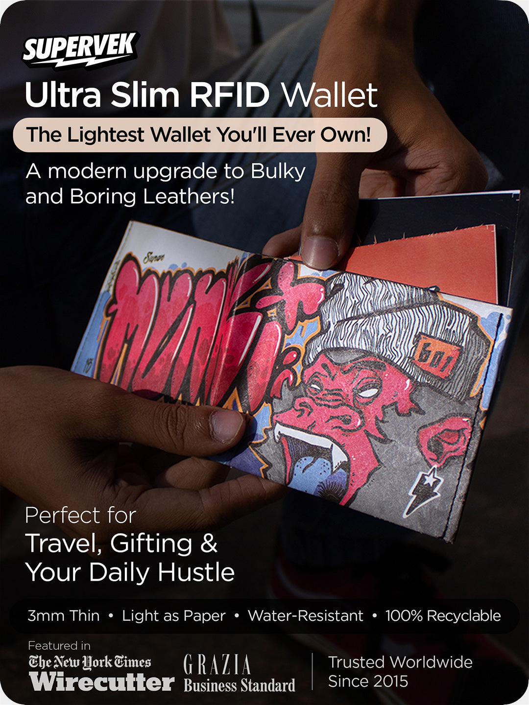 Supervek "Munki" Tyvek wallet shown in hand, ultra-slim RFID-blocking vegan wallet with bold graffiti-style graphic
