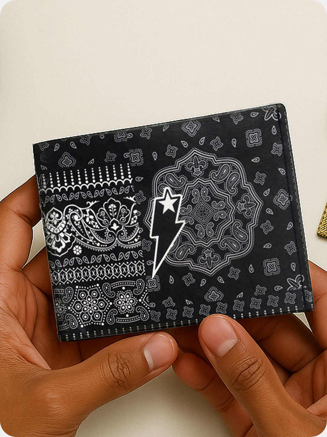 Supervek "Bandana" Tyvek wallet with black bandana print and lightning logo, ultra-slim vegan RFID billfold held in hand