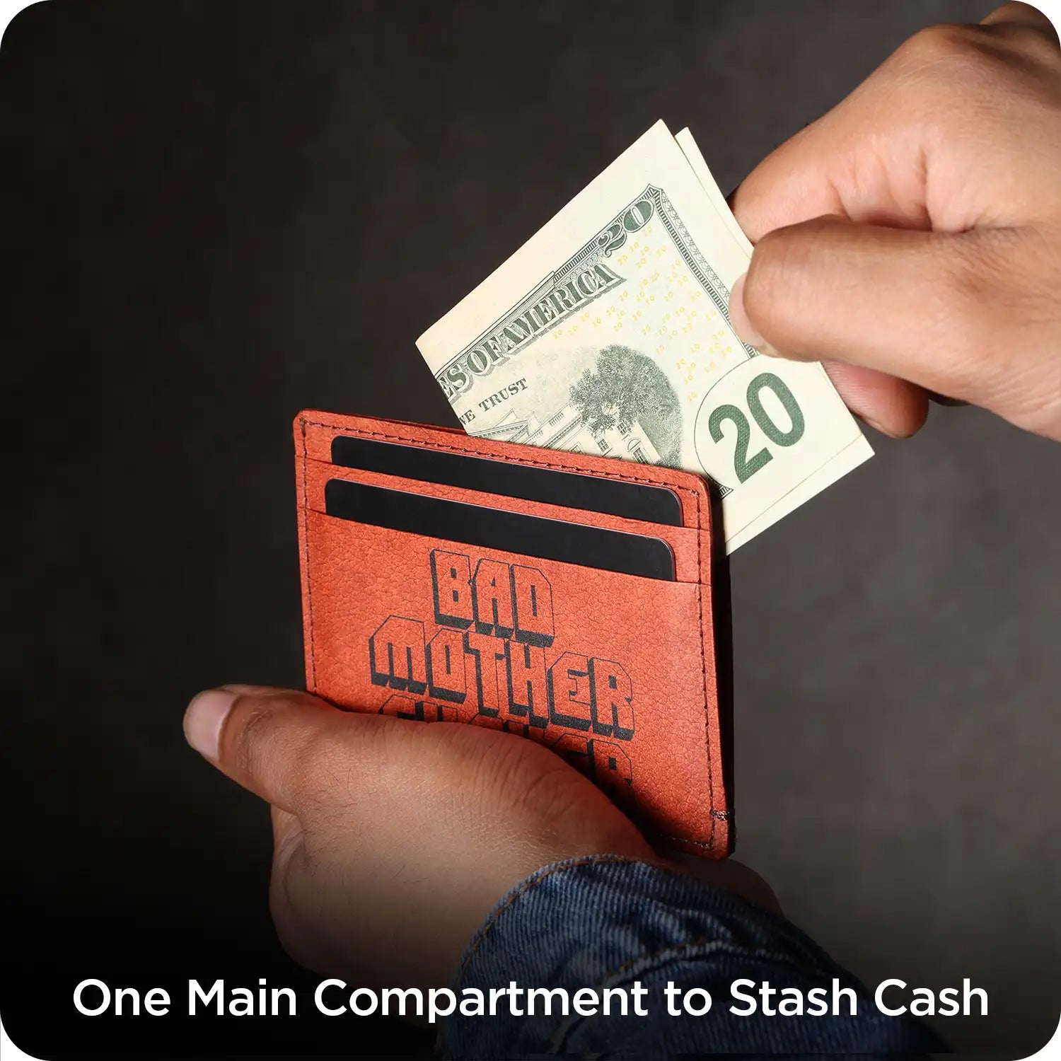 Red wallet with 'Bad Mother' text holding a $20 bill against a dark background