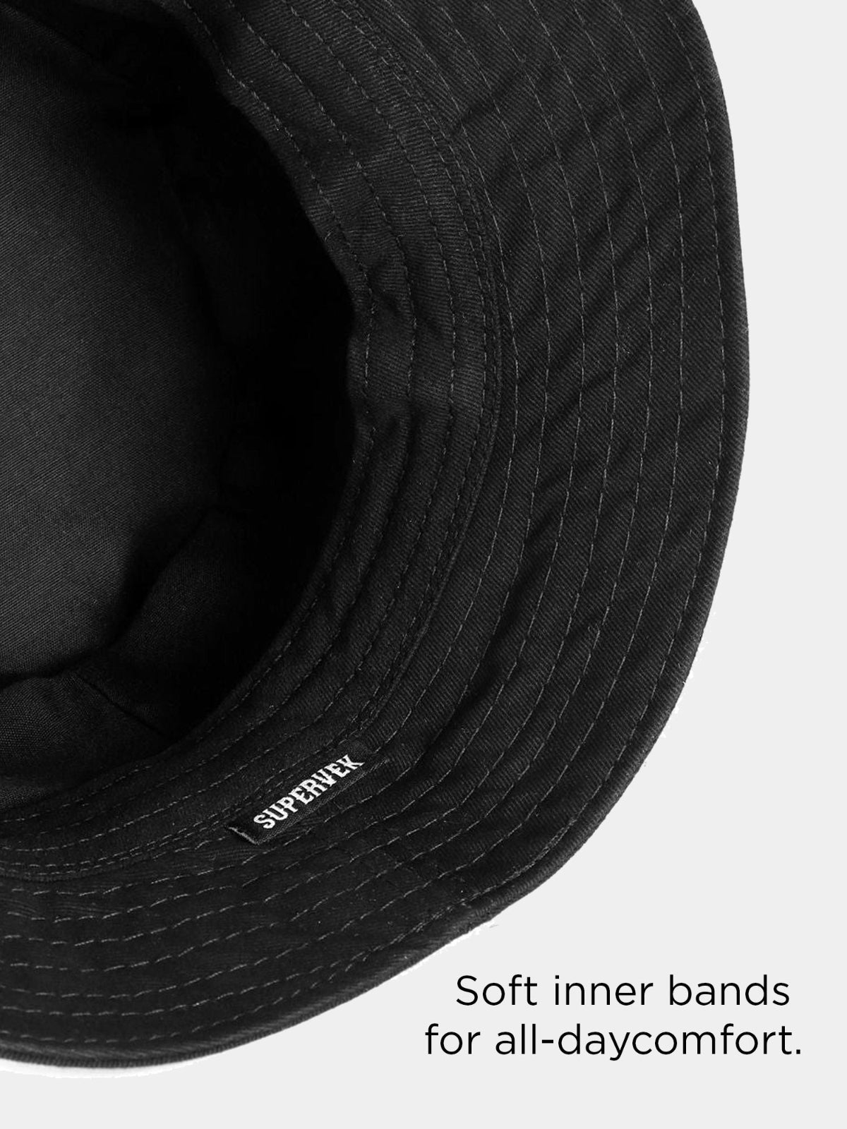 Close-up of a black bucket hat with text 'Soft inner bands for all-day comfort.'